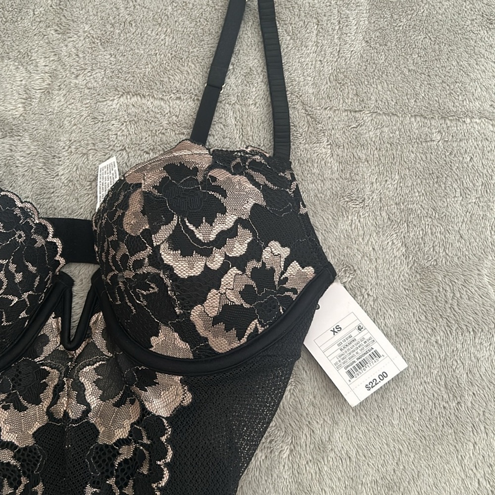Brand new with tags. Super sexy one piece body suit/ lingerie.